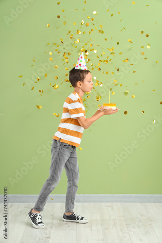 Cute little boy with confet...