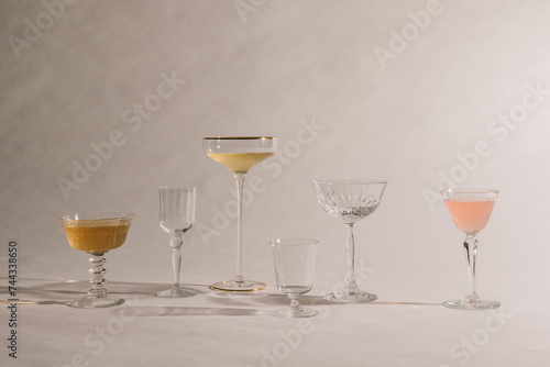 collection of assorted cocktail glasses on white 