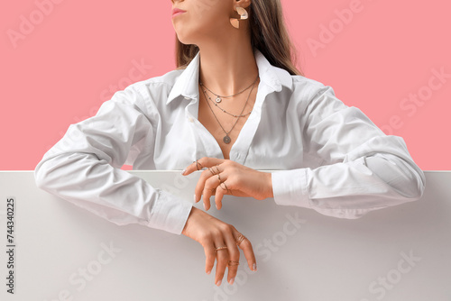 Woman with jewelry on color...