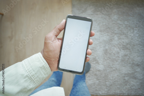 pov shot of holding smart phone with white screen at home  © Towfiqu Barbhuiya 