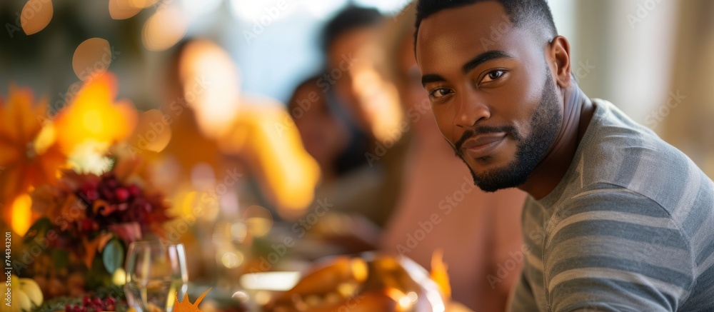 Serene man enjoying beautiful flowers at a charming wooden table in a cozy setting