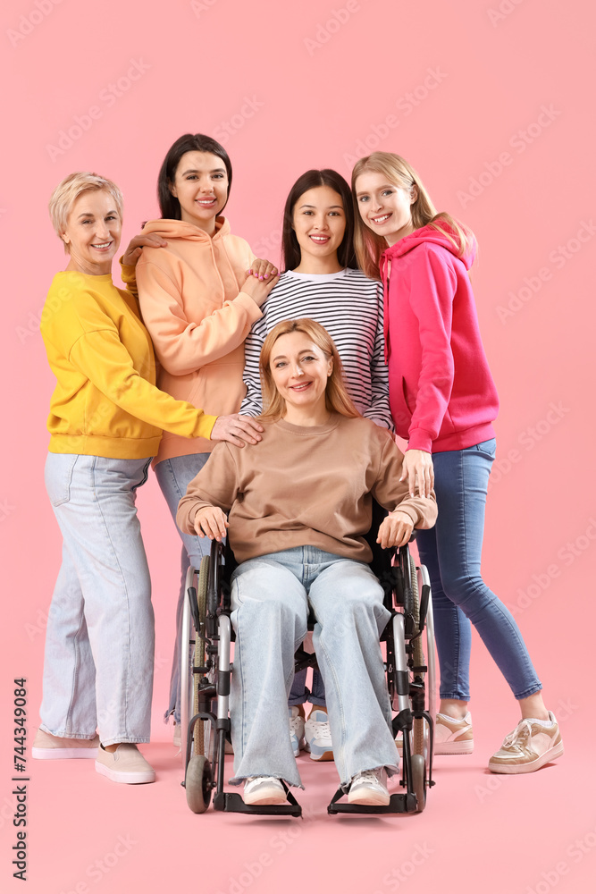 Group of people with woman in wheelchair on pink background Group of people with woman in wheelchair on pink background