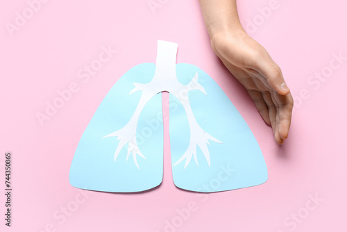 Human hand protecting paper...