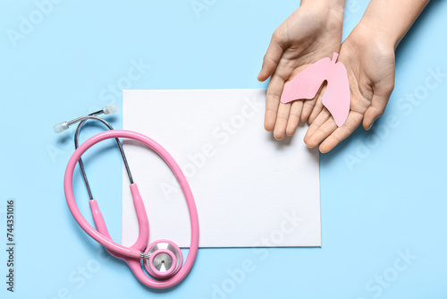 Female hands with paper lun...