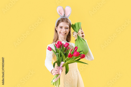 Young woman in bunny ears w...