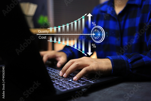 Increasing quality and reducing cost with man working on laptop computer production goal planning  to increase business profit such as eliminating unnecessary processes or using modern machinery