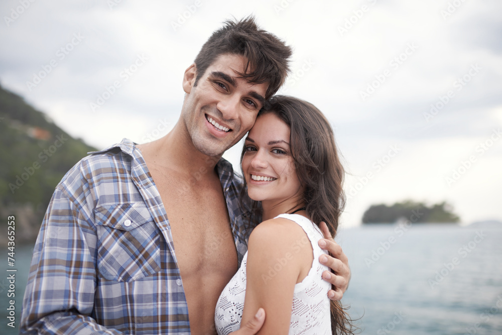 Portrait, smile and couple at ocean on vacation, holiday or travel together outdoor in Italy. Face, man and happy woman at sea for adventure, care and connection in summer by beach in nature for love Portrait, smile and couple at ocean on vacation, holiday or travel together outdoor in Italy. Face, man and happy woman at sea for adventure, care and connection in summer by beach in nature for love