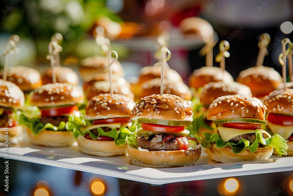 Close-up of delicious mini burgers with fresh ingredients