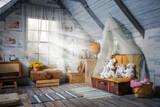 Interior of the children's playroom in the attic of the house in the flood rays of sunlight