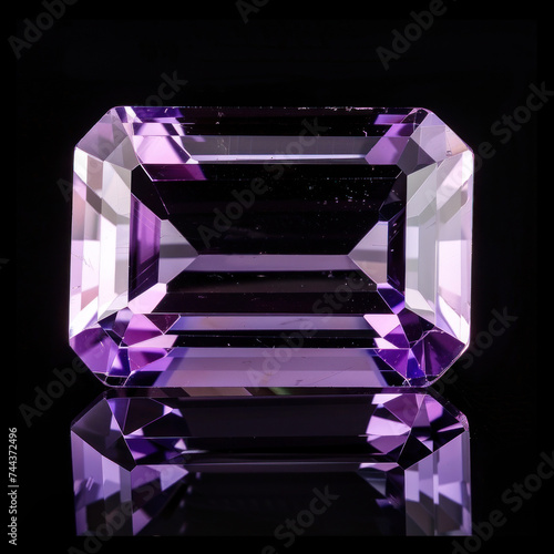 cut Amethyst ​purple gem ​of flawless quality on black background