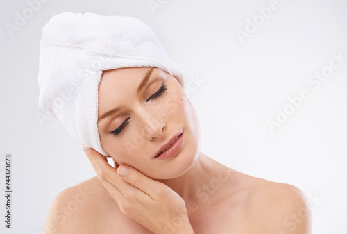 Woman, relax and peace from skincare with beauty and healthy dermatology in studio background. Calm, girl and model with glow or shine on skin from facial, cosmetics or benefits of self care and rest