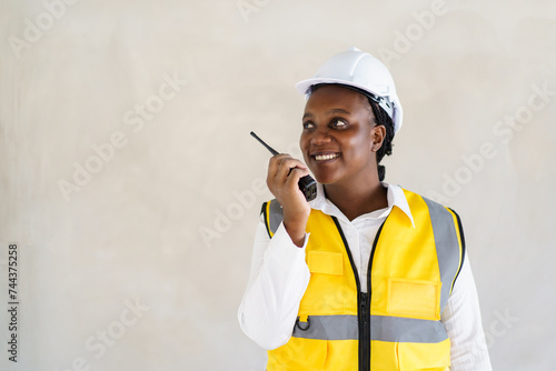Senior professional African black female real estate foreman inspecting inside the building construction.