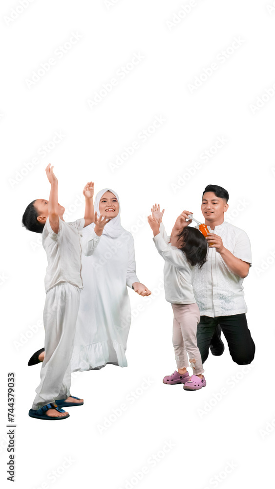 Portrait of happy muslim family playing soap bubbles Portrait of happy muslim family playing soap bubbles