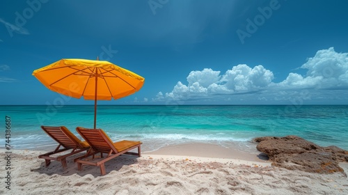 Beach chair and yellow umbrella with blue sky and ocean background © Sumon
