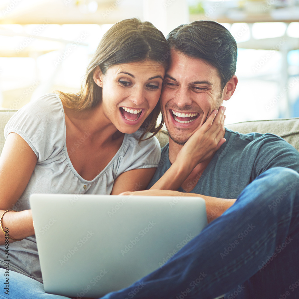 Happy couple, laptop and surprise with good news for winning or online giveaway in living room at home. Excited man or woman with smile on computer in celebration for promo, deal or discount at house