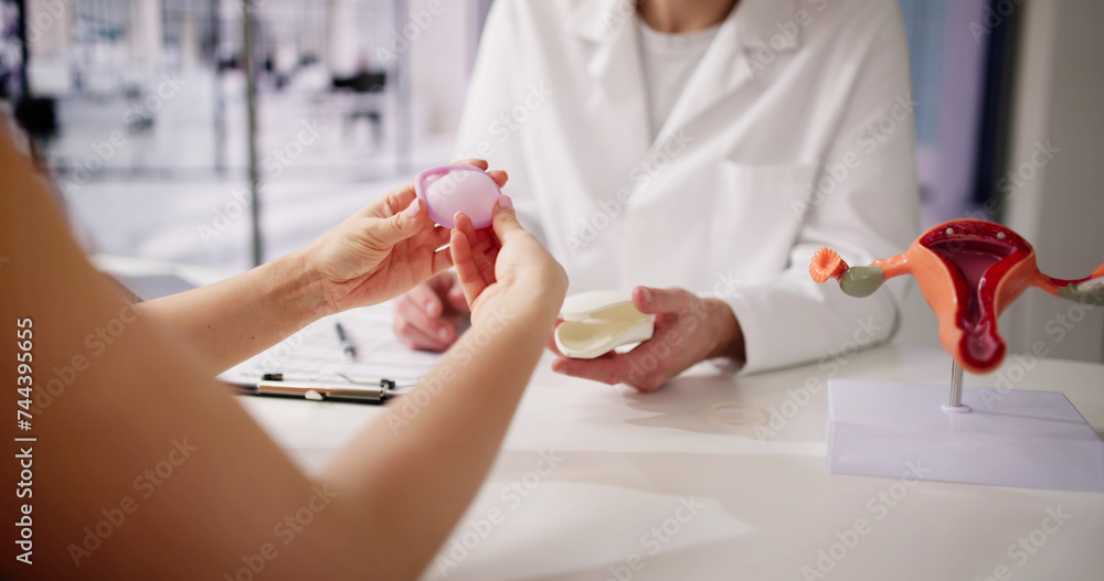 Gynecologist Showing Diaphragm To Woman Gynecologist Showing Diaphragm To Woman