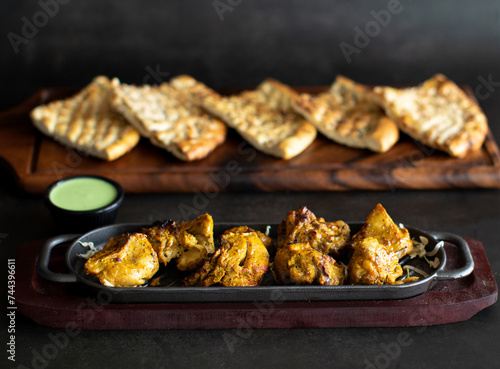 Roasted Chicken pieces with sauces and brads photo