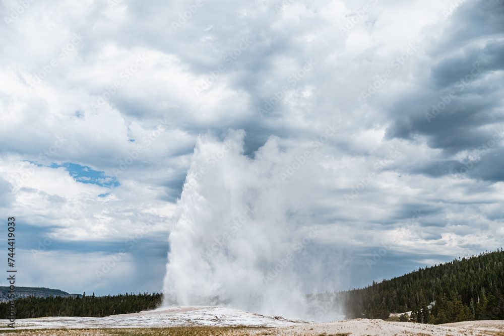 View of Old Faithful erupting at Yellowstone National Park