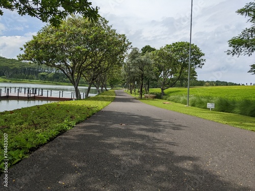 Wallpaper Mural Mini jogging park on the Semarang Central Java with lake, cloudy vibes and blue sky. The photo is suitable for park background, relax and enjoy place content media. Torontodigital.ca
