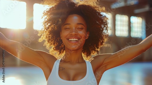 Fitness dance studio class. A joyful and energetic woman dancing in the gym d...