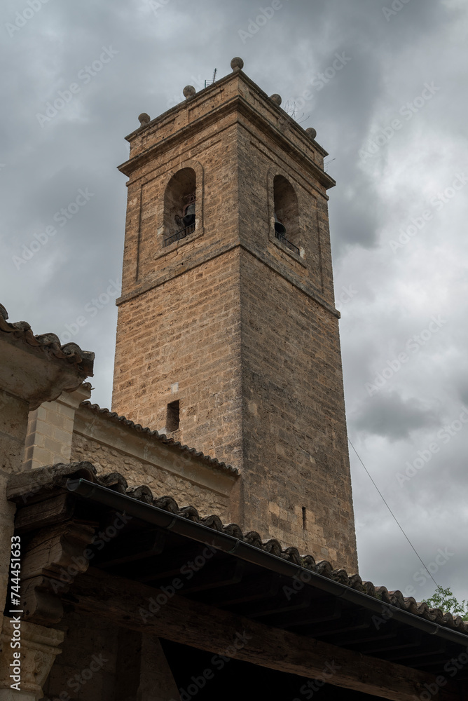 Naklejka premium Bell tower of the Church of Santa Maria de la Pena, in the city of Brihuega, province of Guadalajara, Spain. It was built at the beginning of the 13th century