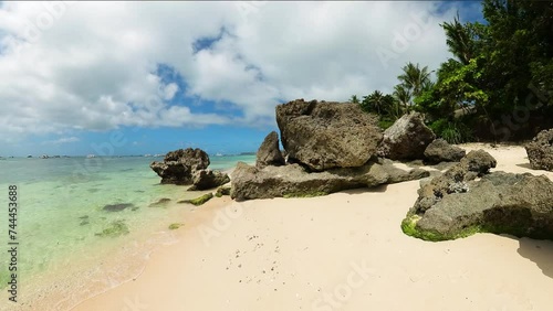 Shoreline with greenish clear water and waves crashing n rocks and sands. Manoc-Manoc. Boracay. Malay, Aklan. Philippines. photo