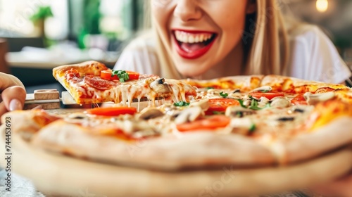With a wide grin, the girl eagerly savors her pizza, exuding an infectious energy and love for good food.