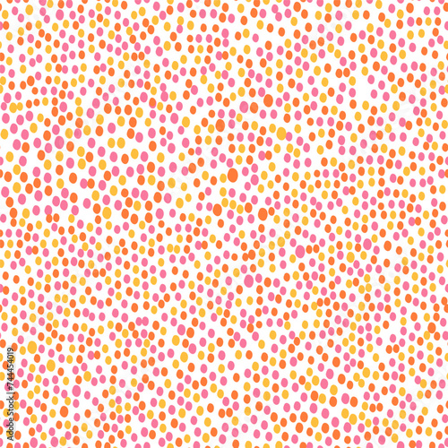 A pattern of pink, red and yellow oval dots on a white background.
