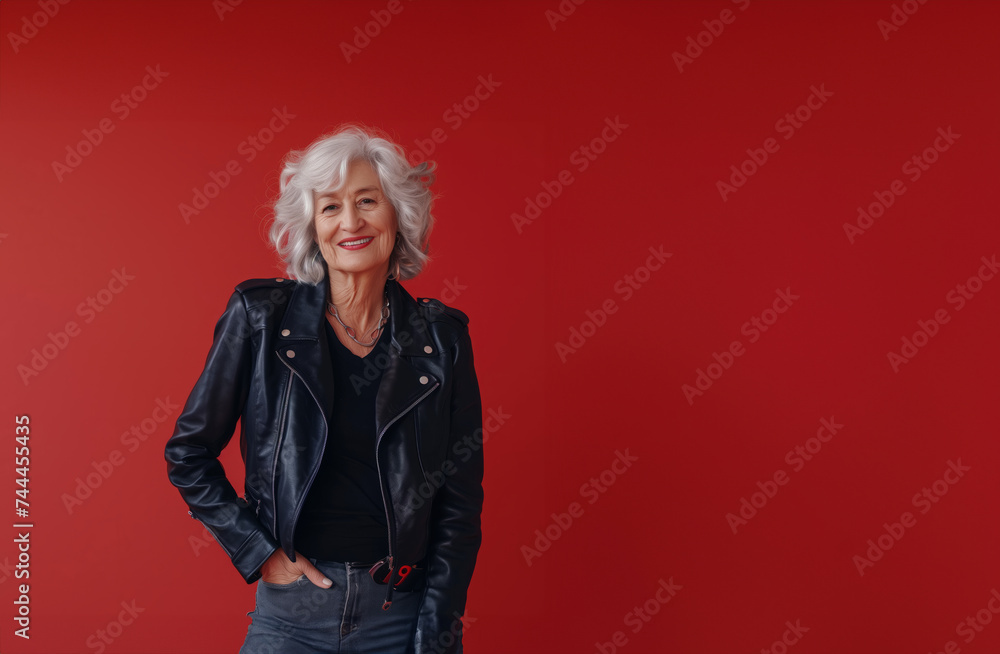 Top view of a smiling grandma in a leather jacket, symbolizing timeless rock and roll. Celebrating elderly strength and character, promoting inclusivity and empowerment. Copy space banner Top view of a smiling grandma in a leather jacket, symbolizing timeless rock and roll. Celebrating elderly strength and character, promoting inclusivity and empowerment. Copy space banner