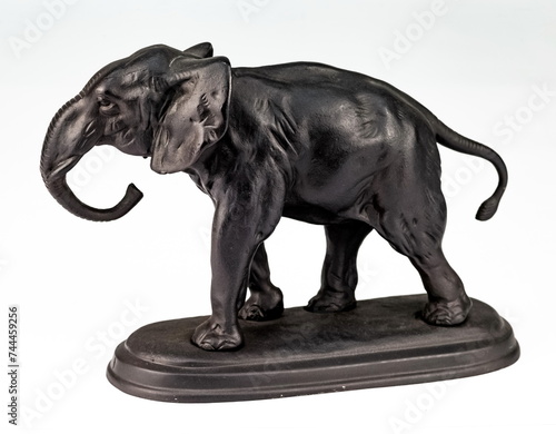 A purchased  consumer  elephant figurine made of cast iron in close-up on a white background