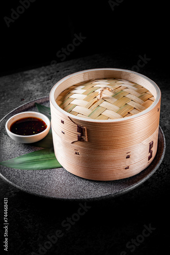 closed bamboo steamer on table