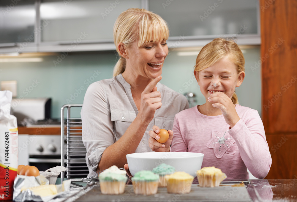 Mother playing, flour or child baking in kitchen or happy family with an excited girl learning cupcake recipe. Home, daughter or fun mom with muffin, help or smile for teaching kid for development
