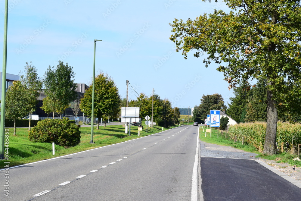 border road with entry sign to Belgium
