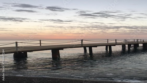 Wallpaper Mural sea ​​waves at sunrise, pier at sea Torontodigital.ca