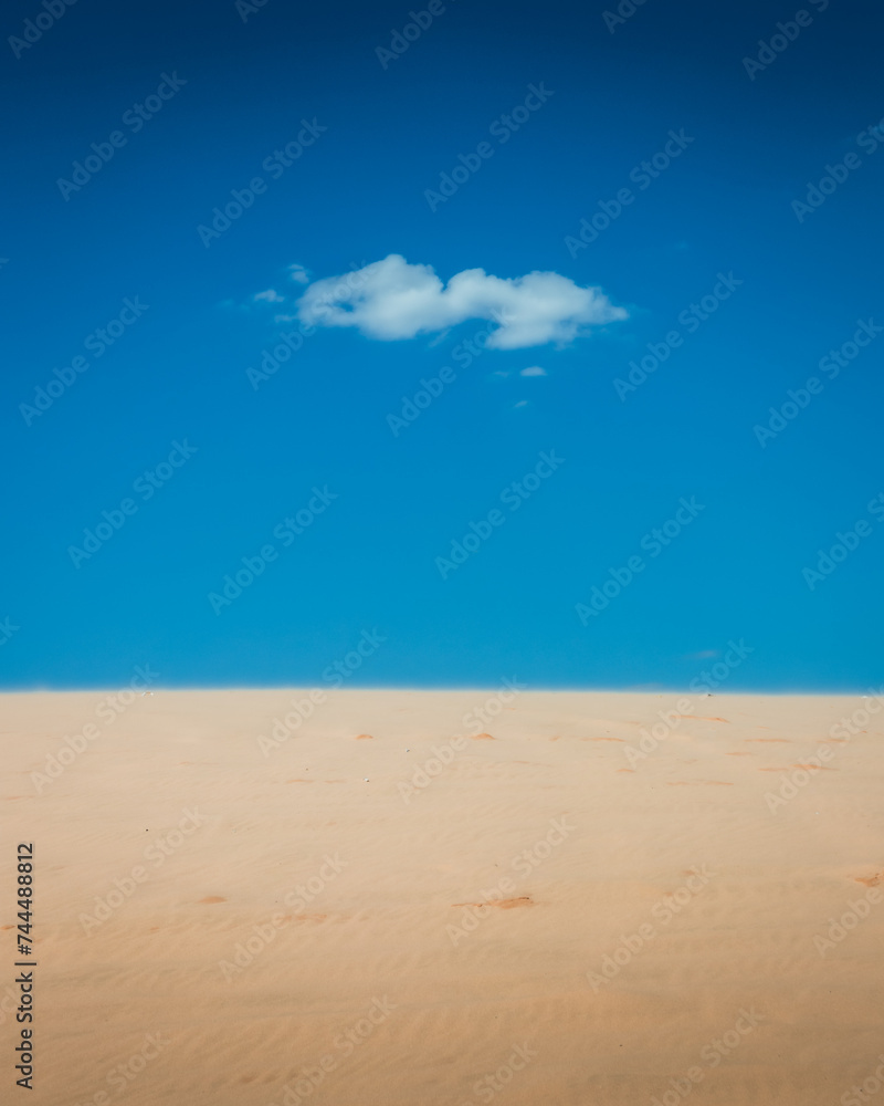 Sand dunes on a blue sky day