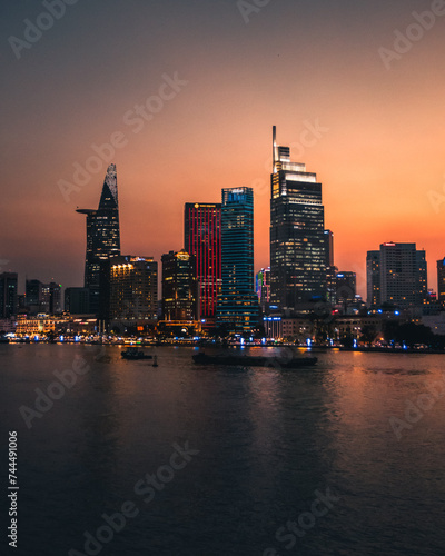 A sunset view of Ho Chi Minh city from over the Mekong river
