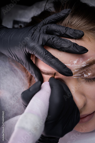 Permanent eyebrow makeup top view. PMU Procedure, Permanent Eyebrow Makeup.