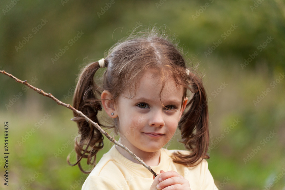 Portrait of a little girl with long hair in the nature. Portrait of a little girl with long hair in the nature.