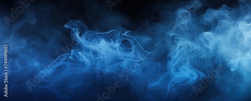 Ethereal Blue Smoke Wafting Through Dark Background in a Mysterious Studio Setting
