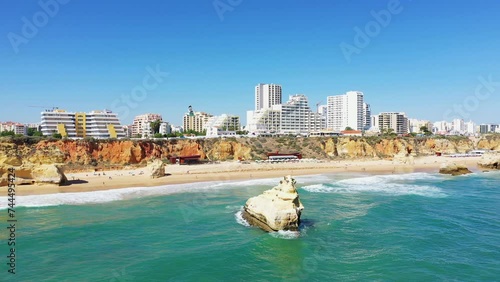 The city of Albufeira on the edge of the cliffs and the Ocean , in Europe, in Portugal, in the Algarve, in summer, on a sunny day. photo