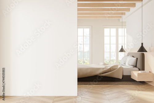 White master bedroom interior with cozy bed and blank wall