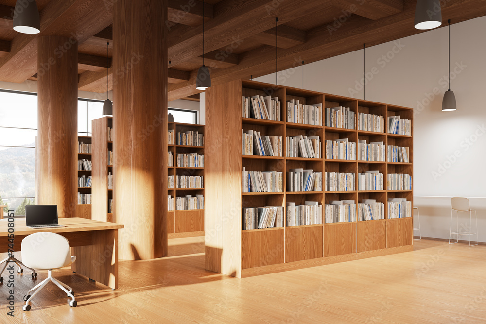 Wooden library interior with workspace and laptop, bookshelf and window