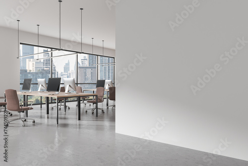 Office interior with desk and pc desktop with armchairs, window. Mock up wall © ImageFlow