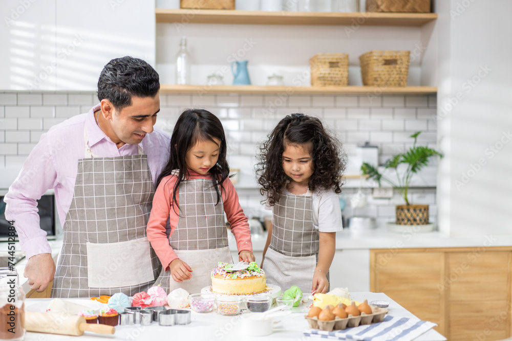 Portrait of enjoy happy love asian family father with little asian girl daughter child play and having fun cooking food together with baking cookie and cake ingredient in kitchen Portrait of enjoy happy love asian family father with little asian girl daughter child play and having fun cooking food together with baking cookie and cake ingredient in kitchen