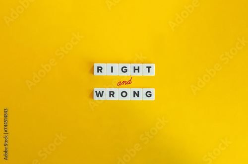 Right and Wrong Banner. Concept of Moral Compass, Moral Dilemmas, Ethical Behavior and Decision-making. Text on Block Letter Tiles on Yellow Background. photo