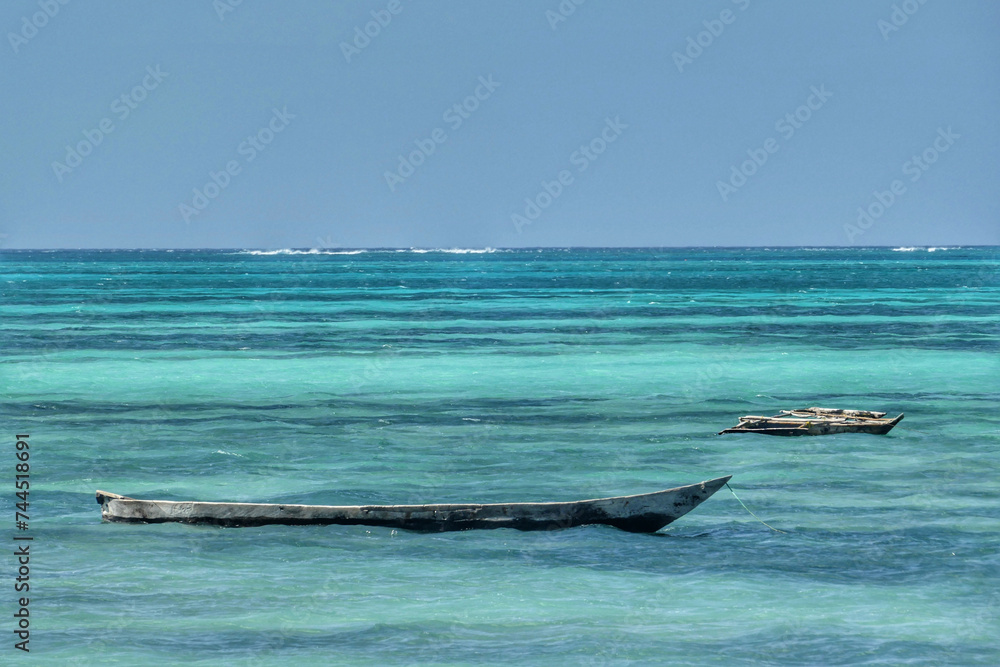 Fototapeta premium Scenic view of moored boats at Jambiani beach, Zanzibar