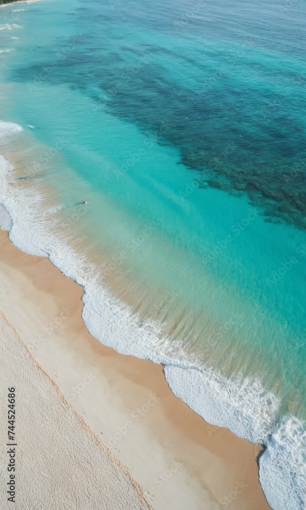 Aerial view on tropical beach with white sand and crystal clear turquoise water in sea