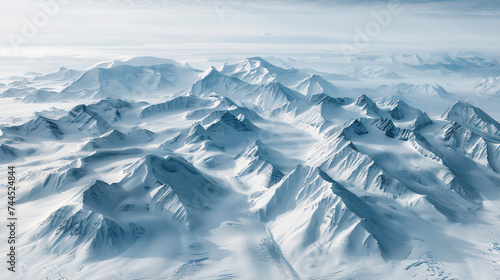 Aerial view of a snow-covered mountain range.