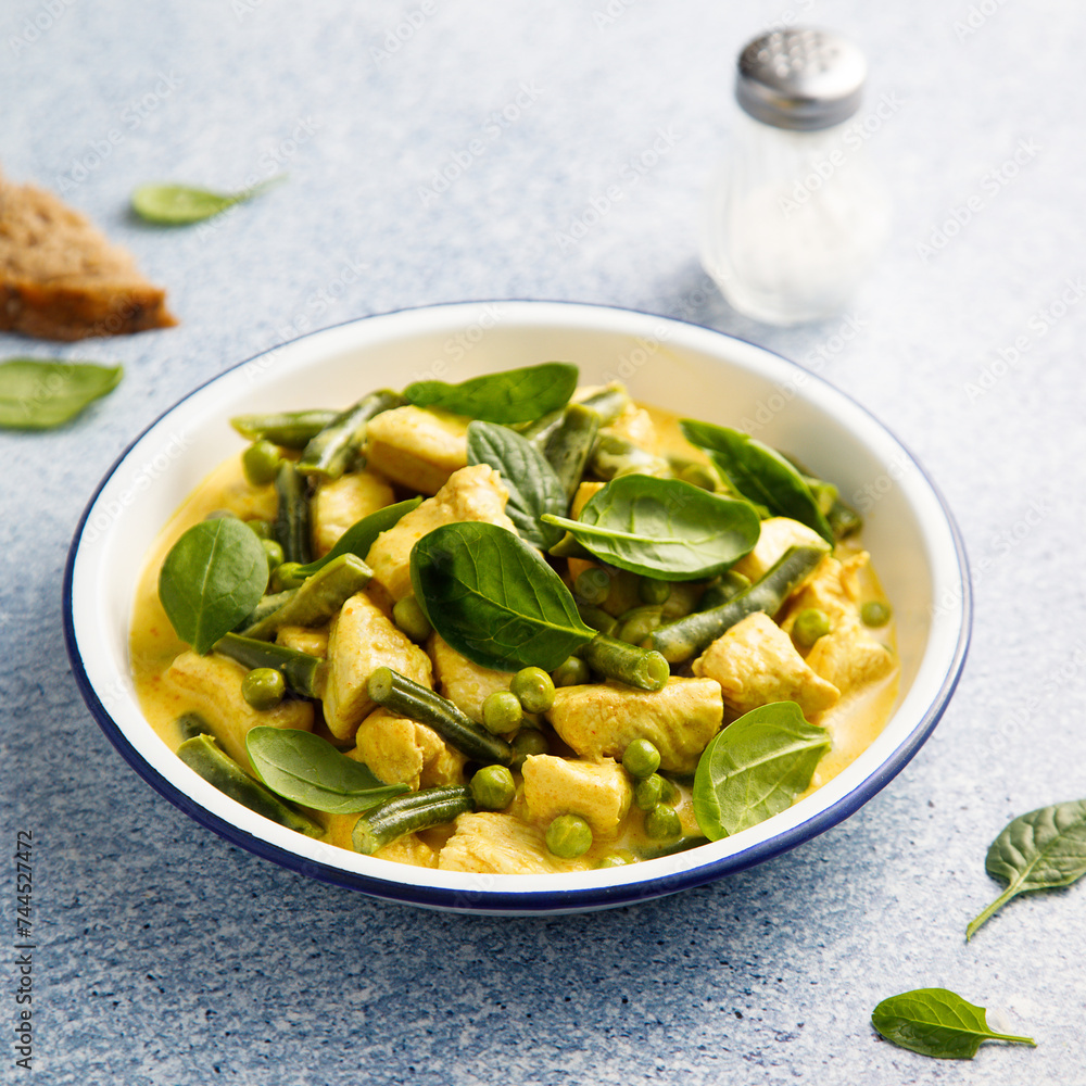 Homemade chicken curry with spinach and pea Homemade chicken curry with spinach and pea