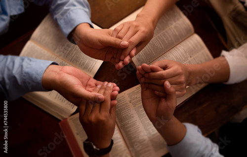 Three men pray together  gratitude  trust  and friends in a circle pray together for religion  community  and connection. Pray to God with the Bible